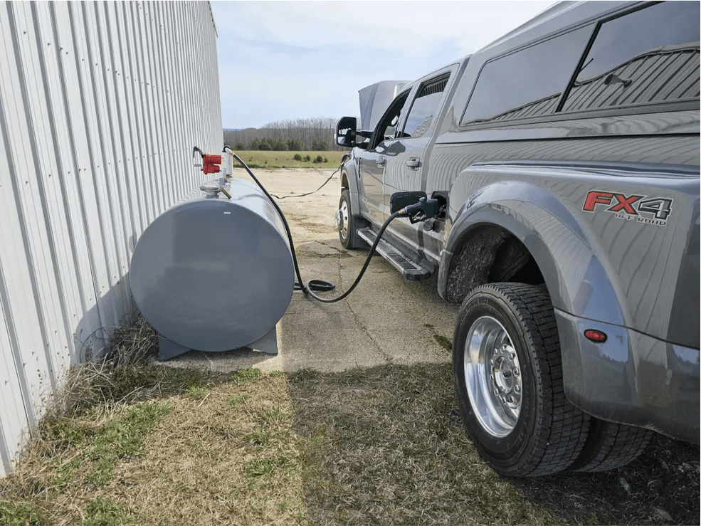 Ford Super Duty truck refueling from a bulk fuel storage tank