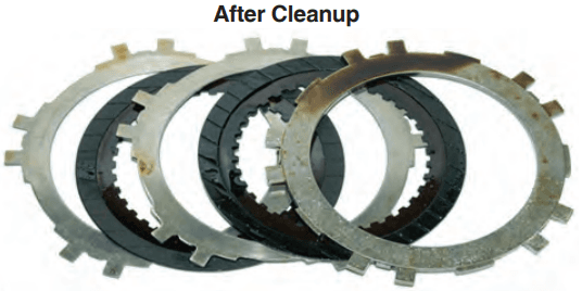 Automatic transmission clutch plates after cleanup with AMSOIL Engine and Transmission Flush reveal lighter glazing and varnish.