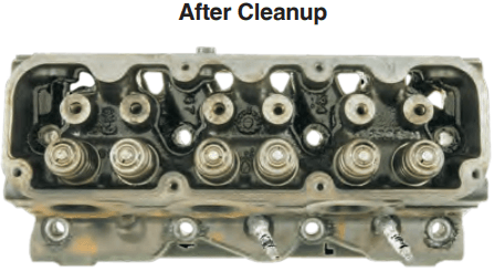 Cylinder head after cleanup with AMSOIL Engine and Transmission Flush. The valve springs and push rod openings are noticeably cleaner, with fewer sludge deposits. The manufacturer’s stamping is more easily seen.