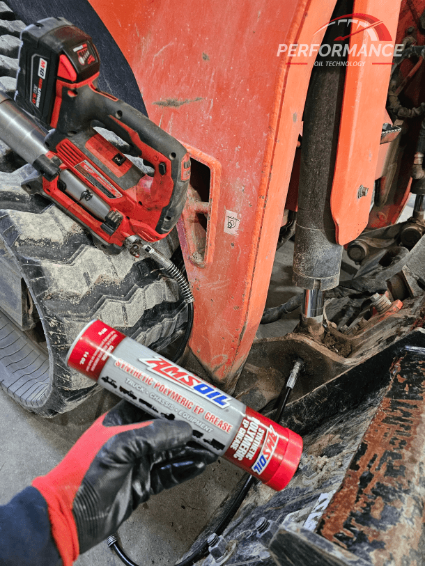 Kubota track loader with my Milwaukee Cordless Grease Gun and AMSOIL Synthetic Polymeric NLGI #2