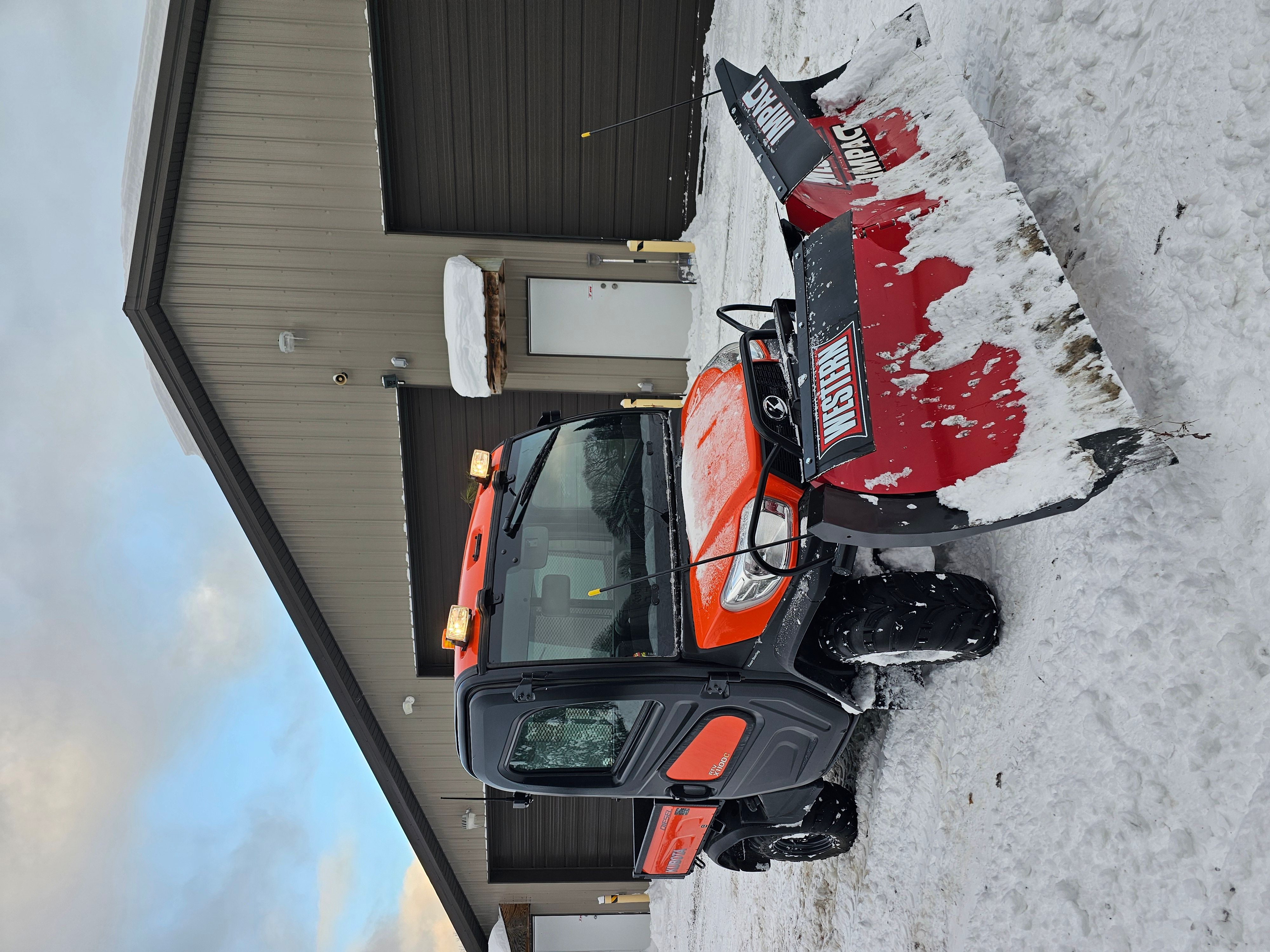 One of my Kubota RTV's plowing snow